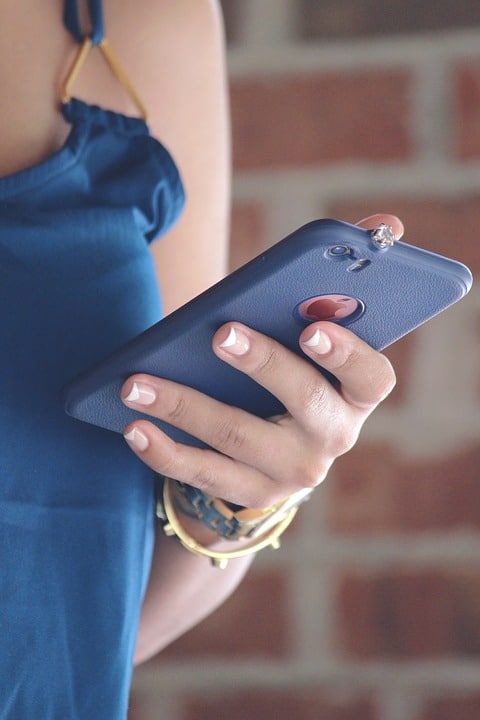 woman on cell phone nice nails