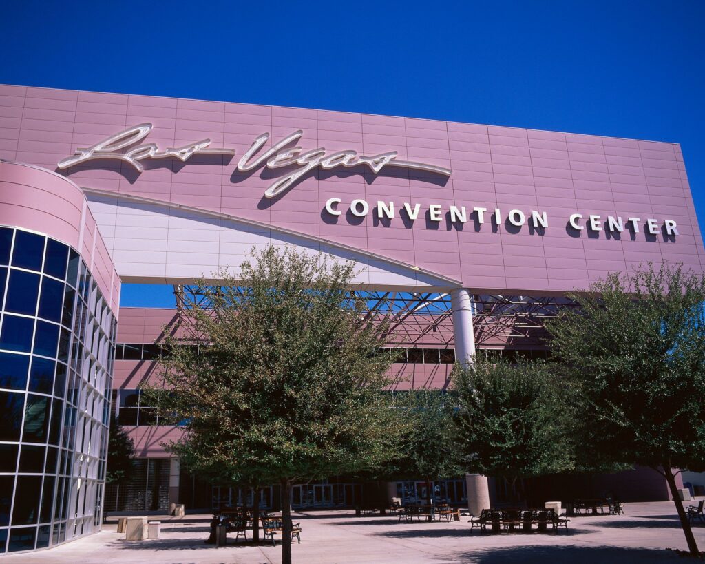 Exterior view of the Las Vegas Convention Center under a clear blue sky.